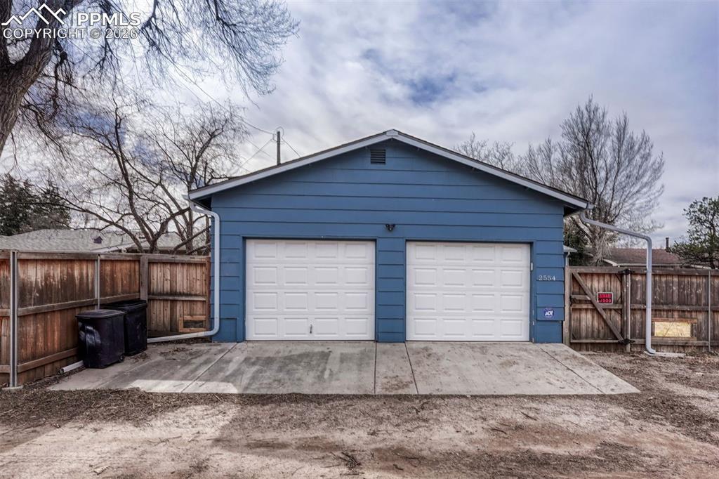 Oversized detached 2-car garage with convenient alley access.