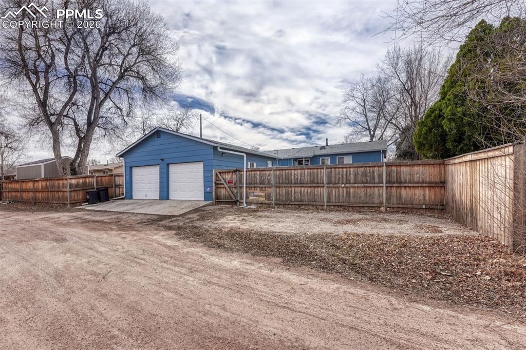 Additional parking off the alley has enough space to add a carport
