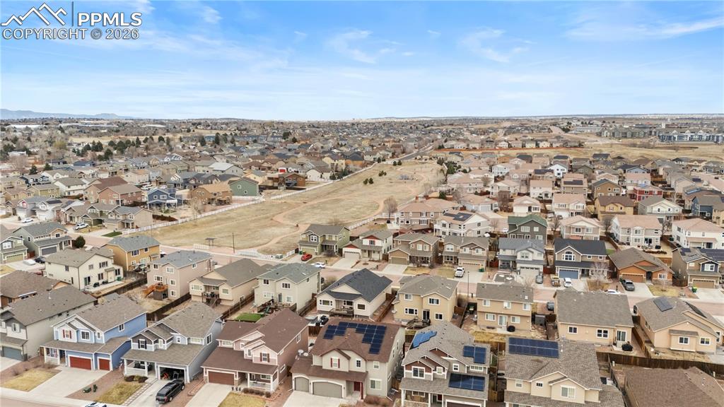 Aerial view of community to include walking trails and playground area.