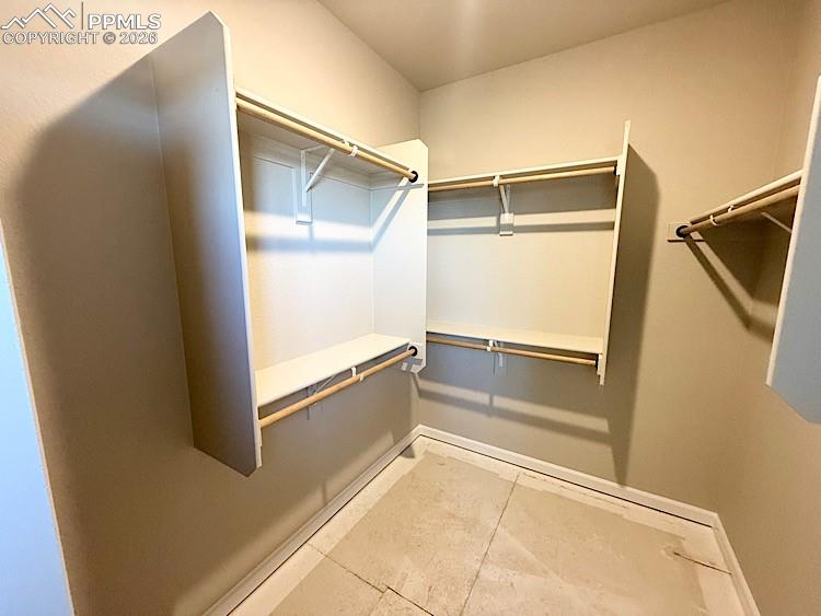 Primary Closet with wood shelving and rods!