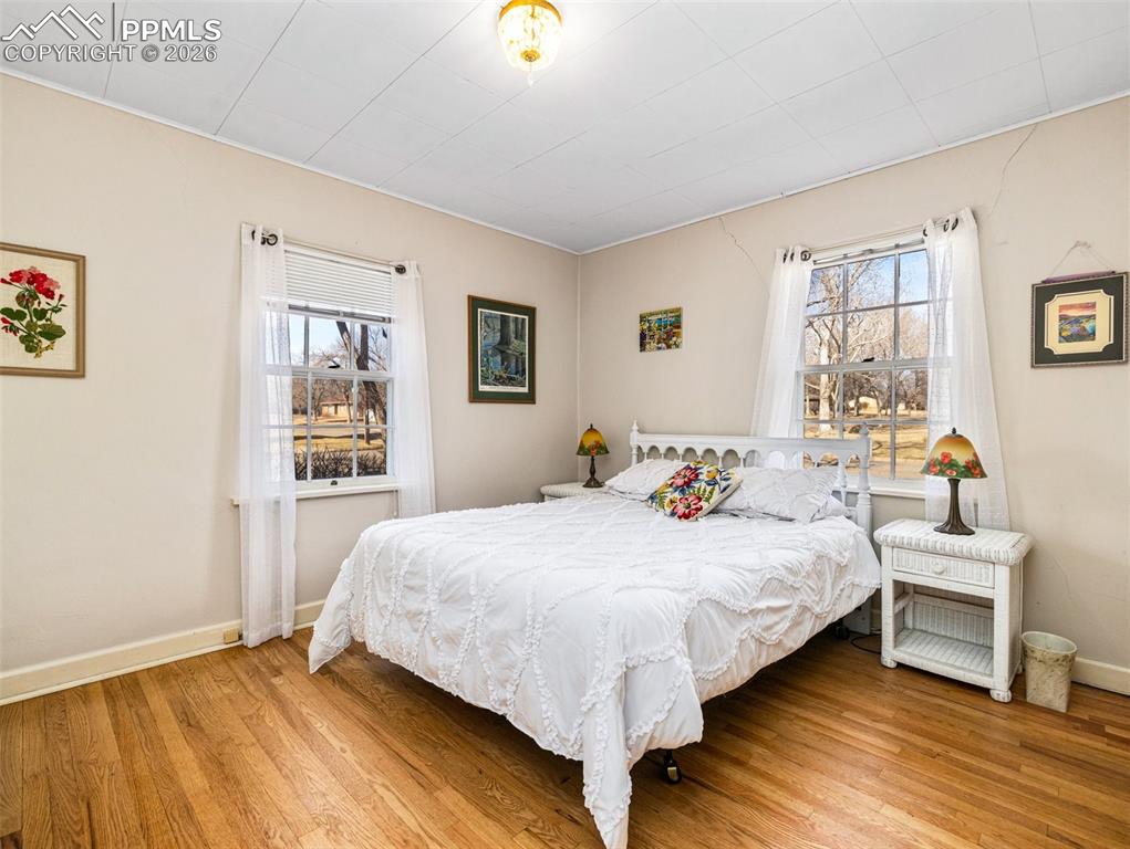 The main level bedroom has newly finished hardwood floors