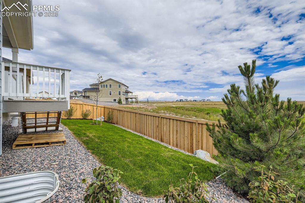 View of fenced backyard