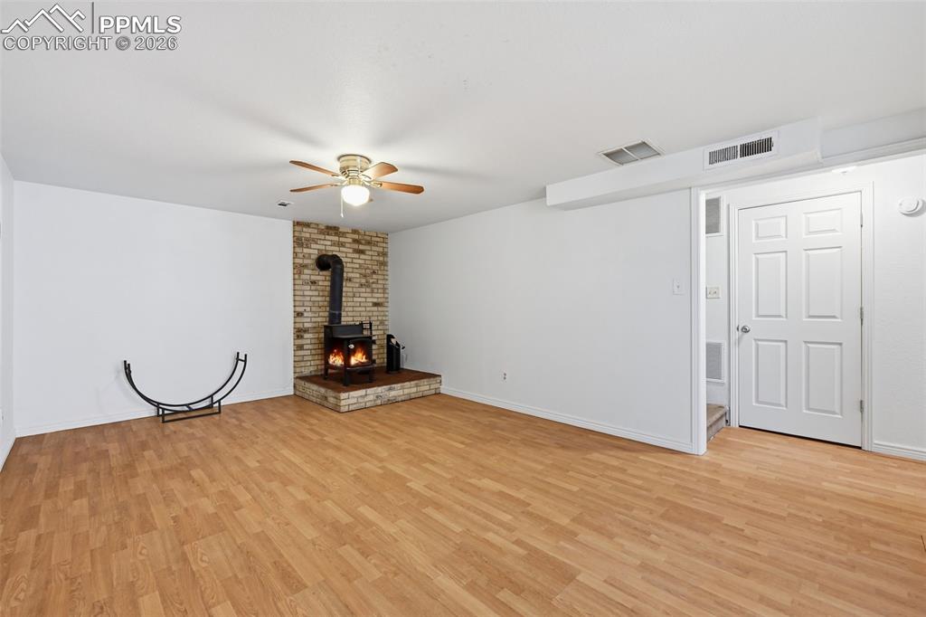 With wood burning stove and plank flooring