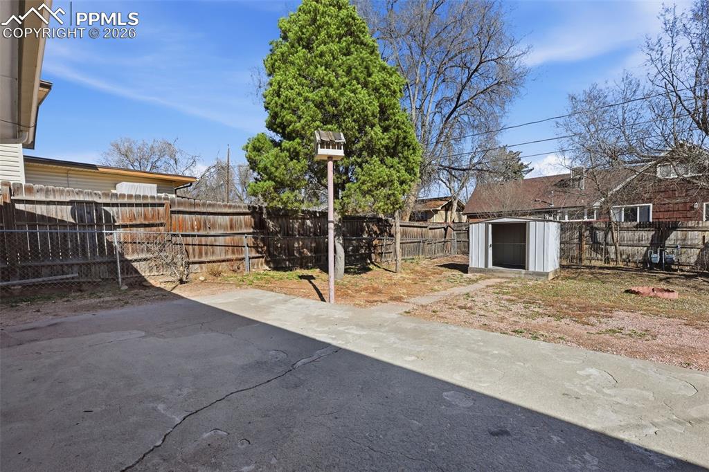 Concrete back patio off of kitchen