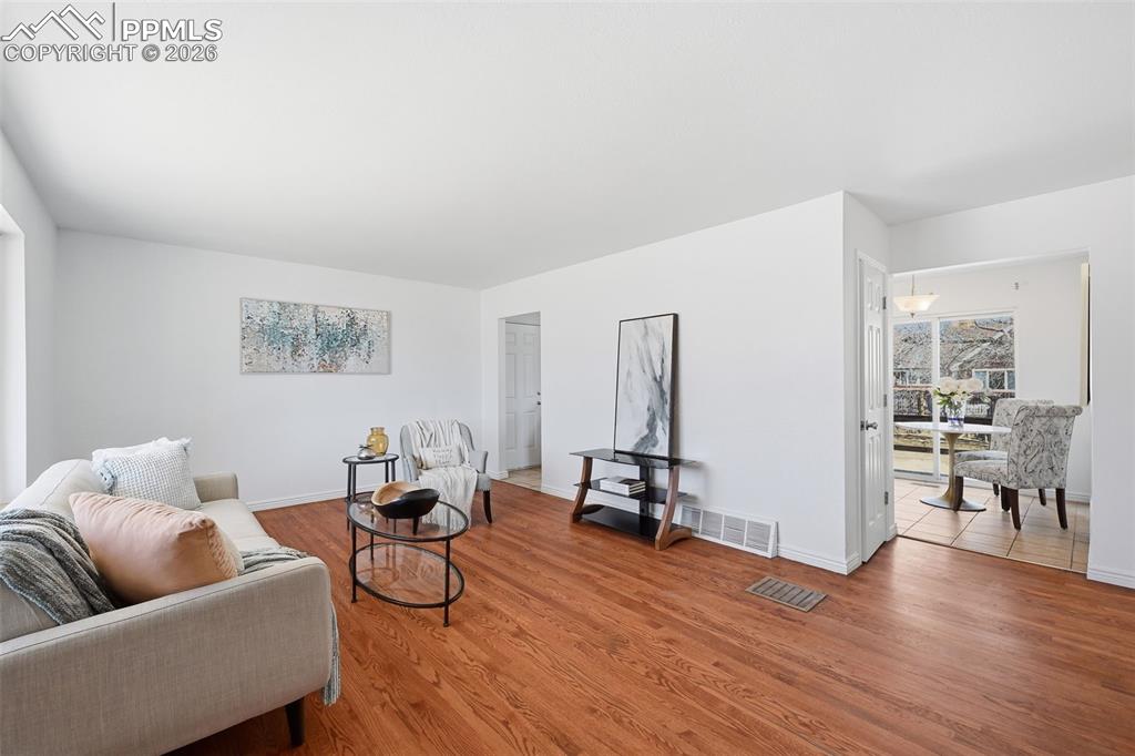 Large family room with real wood floors