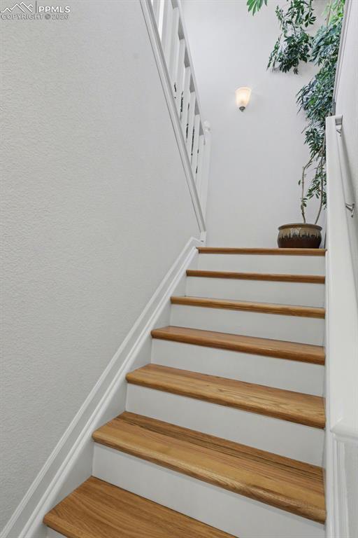 Hardwood stairs and hardwood flooring in the loft