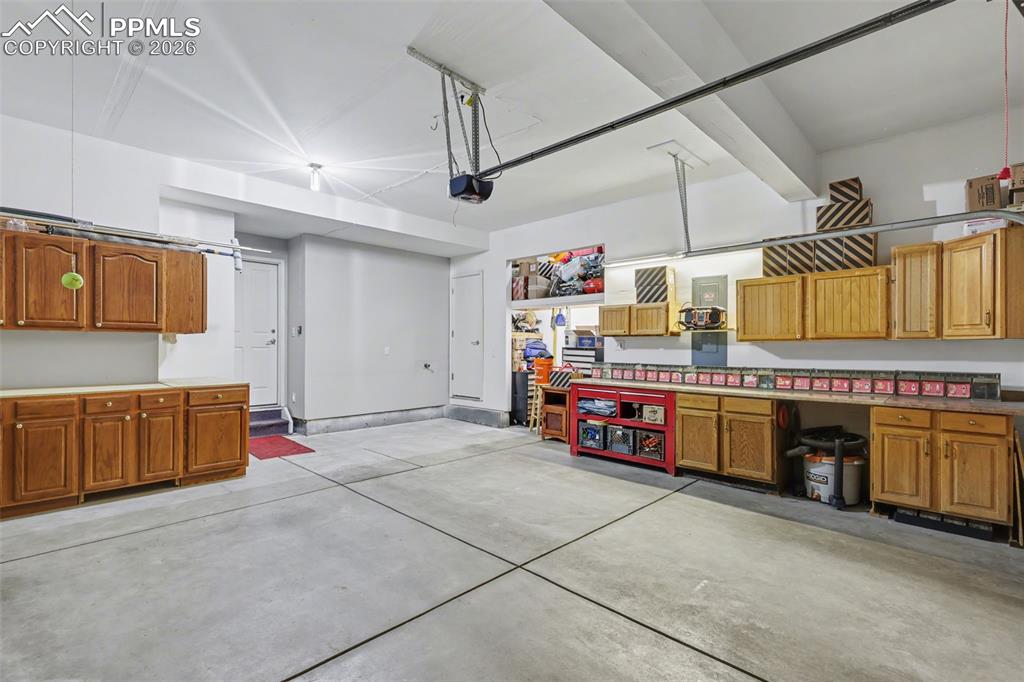 Interior Garage with cabinets and storage