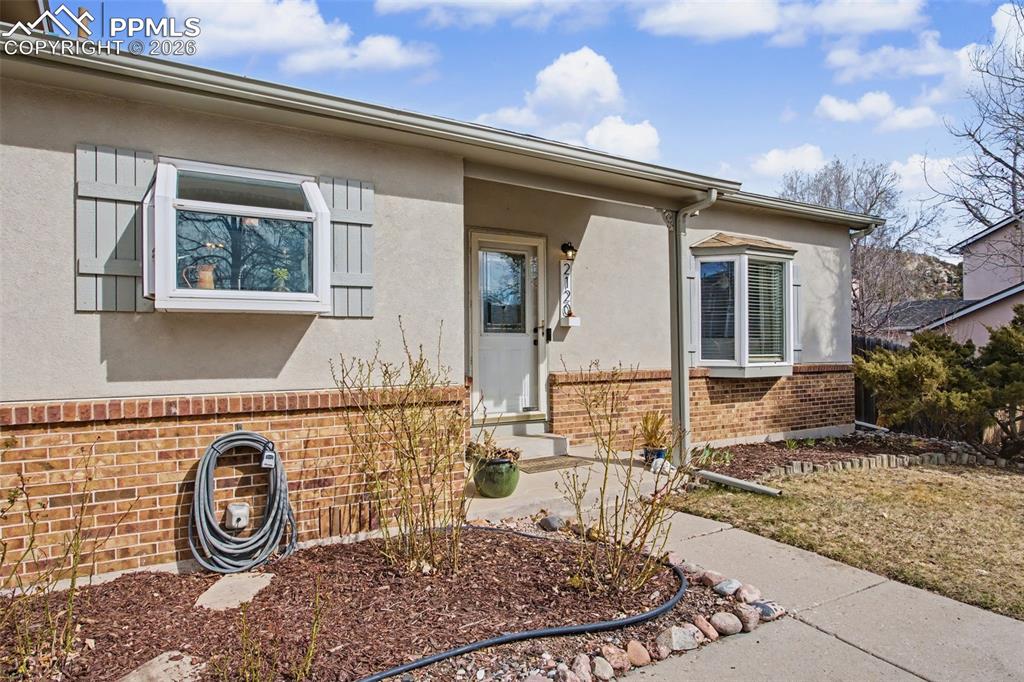 Front with garden and bay windows