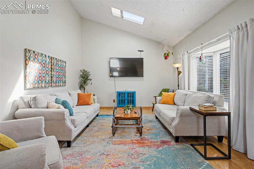 Light & bright living room with ample natural light from bay window