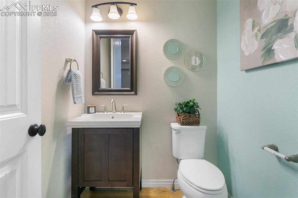 Bathroom featuring vanity and wood finished floors