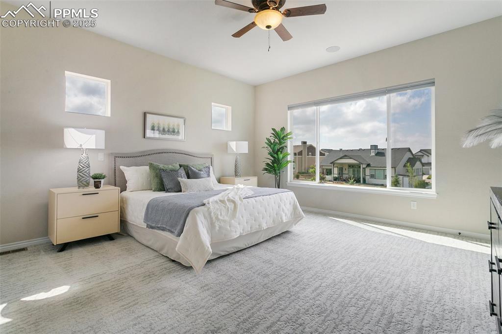 Bedroom with carpet flooring and ceiling fan