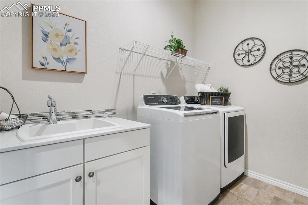 Laundry room with washer and dryer and cabinet space