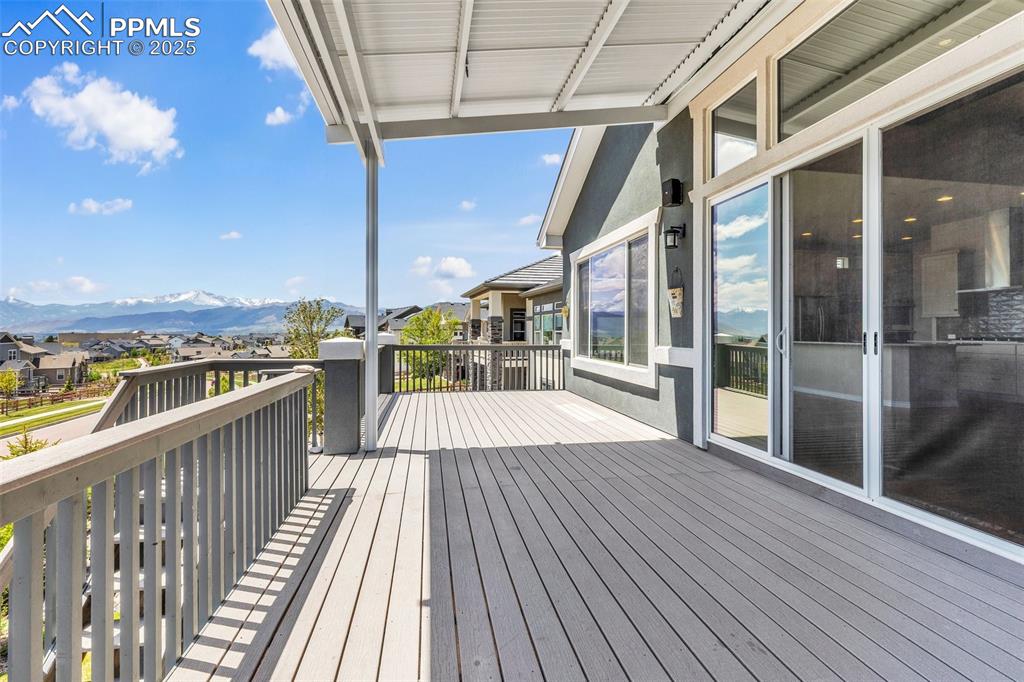 Deck featuring a mountain view and a residential view