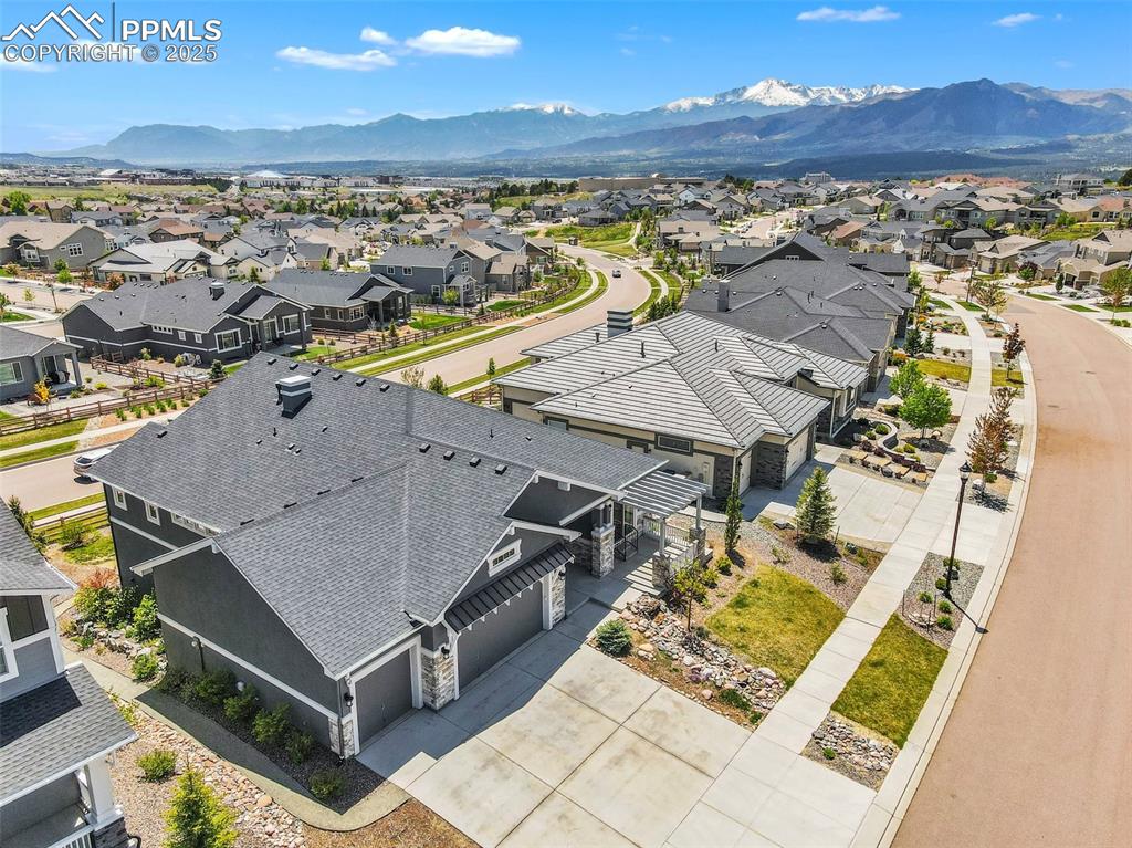 Aerial perspective of suburban area with a mountain backdrop
