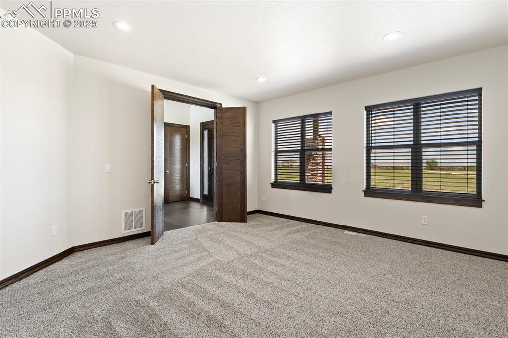 Office featuring carpet flooring, French doors and recessed lighting