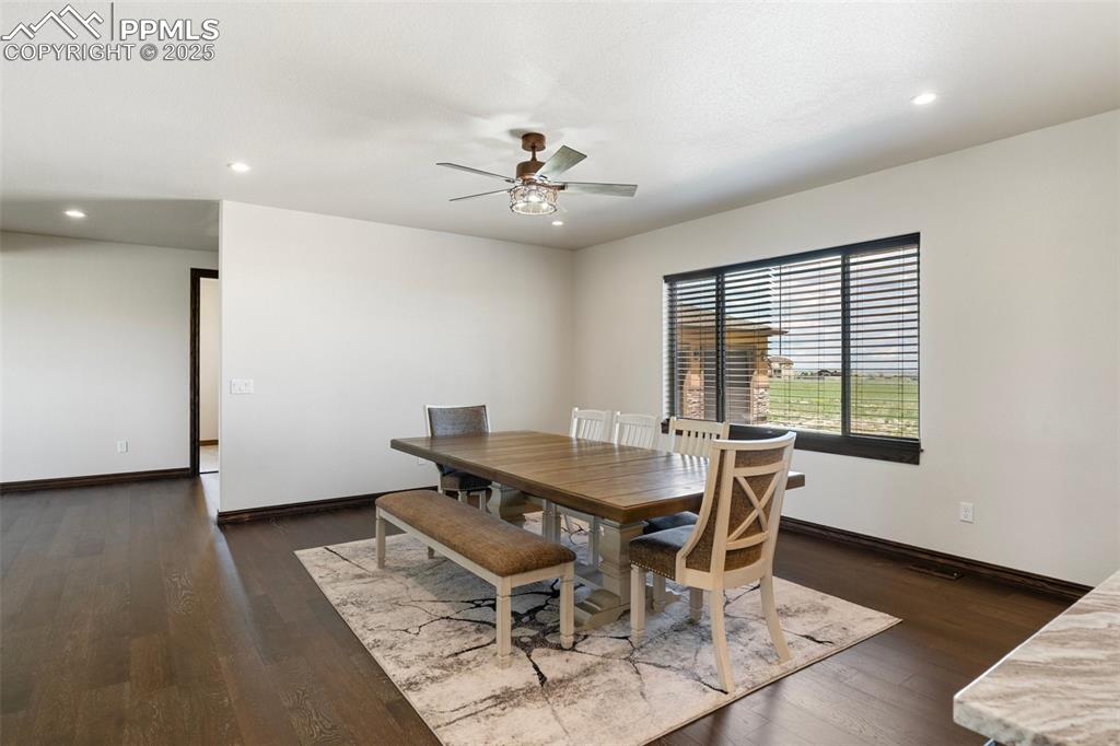 Dining space featuring ceiling fan, recessed lighting, and wood finished floors