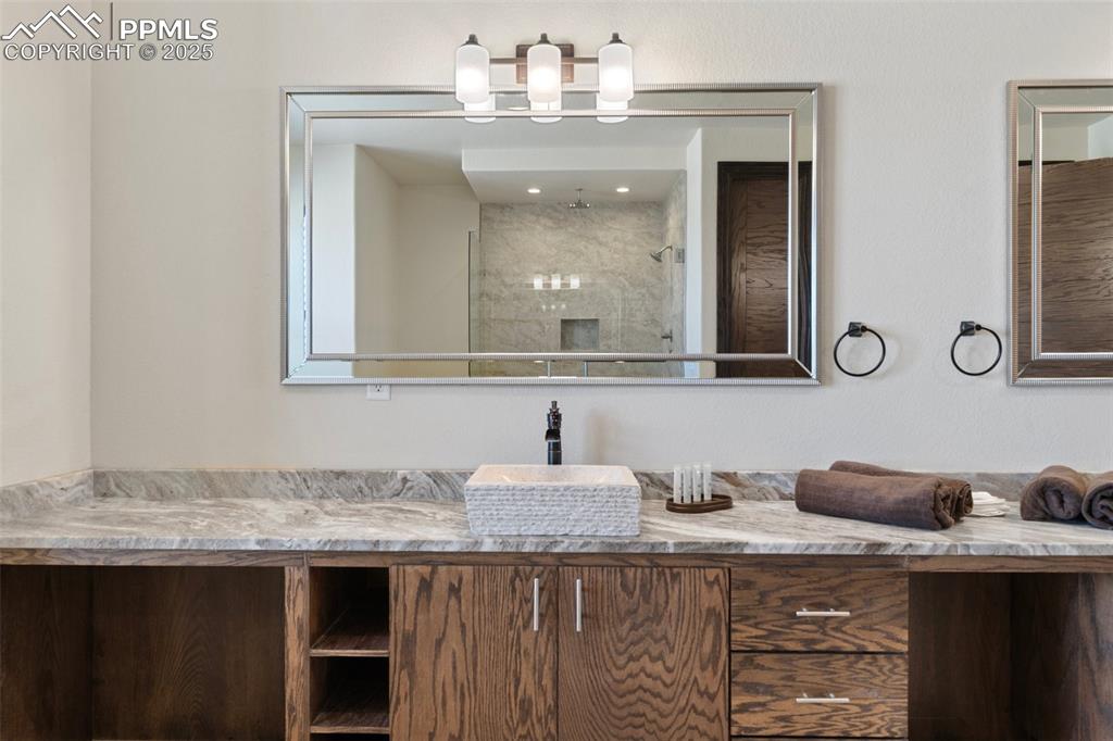 Main level Primary Bathroom with vanity and a shower