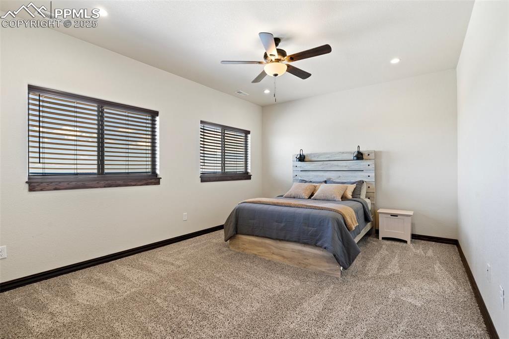 Bedroom featuring carpet, recessed lighting, and a ceiling fan