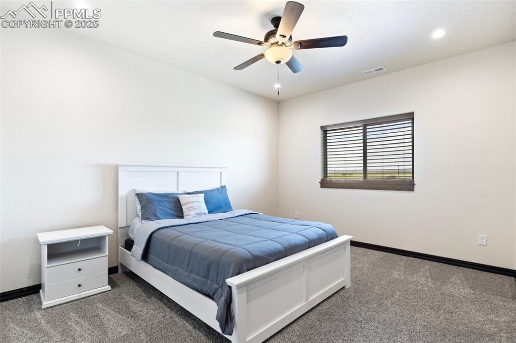 Bedroom featuring carpet, a ceiling fan, and recessed lighting