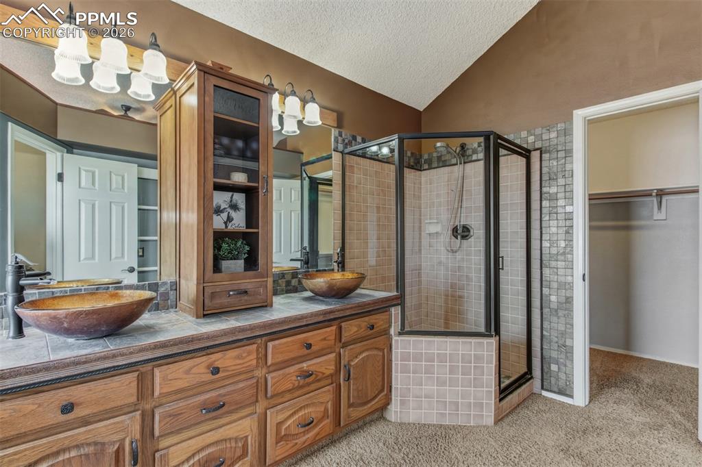 Spacious walk-in shower and large walk-in closet.