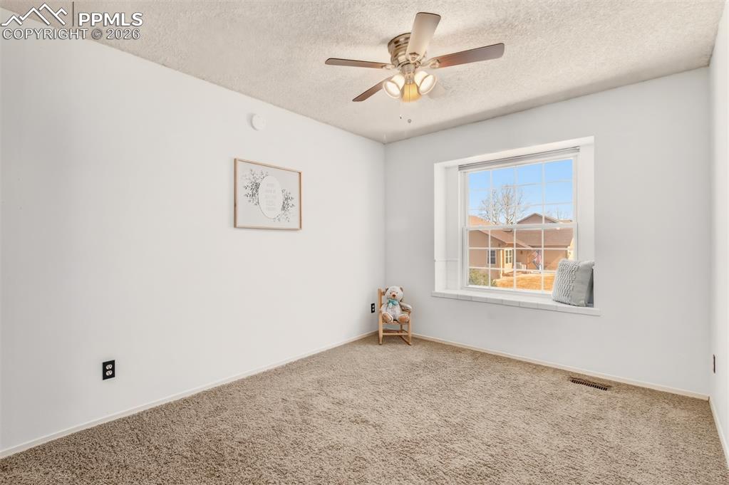 Bedroom #2 with a window seat. 