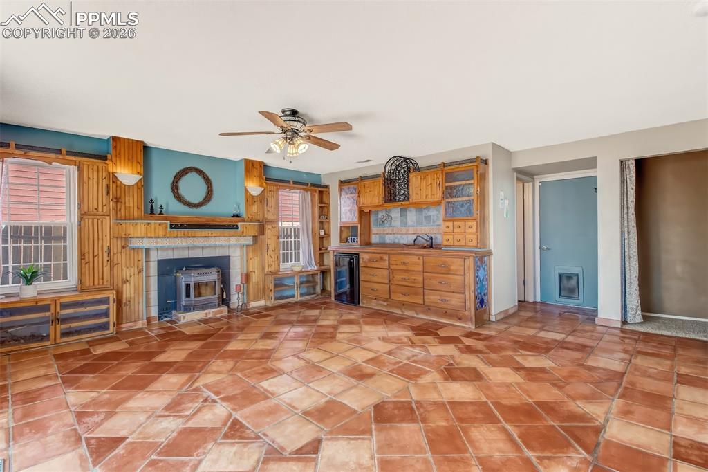 Another view of the family room...wet bar with beautiful ceramic bowl, mini fridge and an abundance of drawers for storage. 