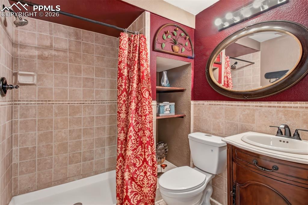 3/4 bath with built-ins located in the basement.