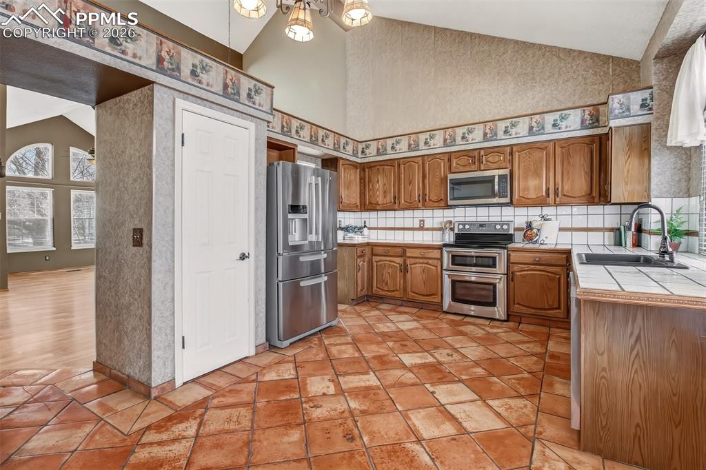 Matching ceramic tile countertops and backsplash.