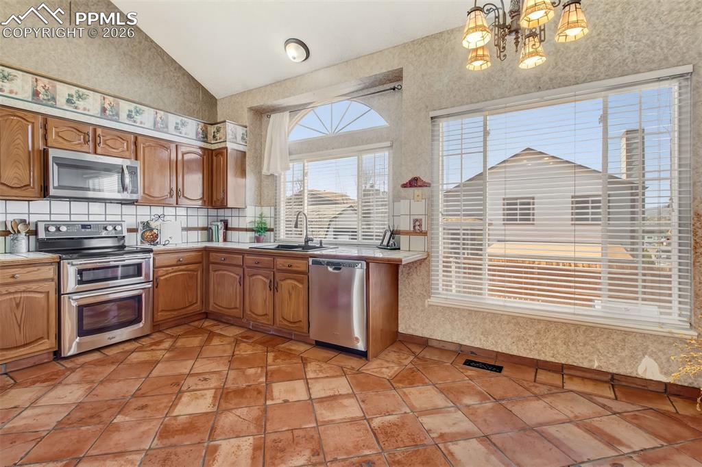 Large window over the kitchen sink allows plenty of natural light. 