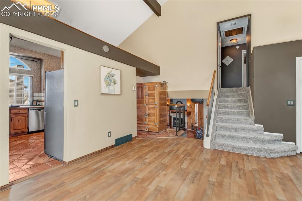 Another view of the Seeger Siphon Refrigerator and staircase leading to the upper level.