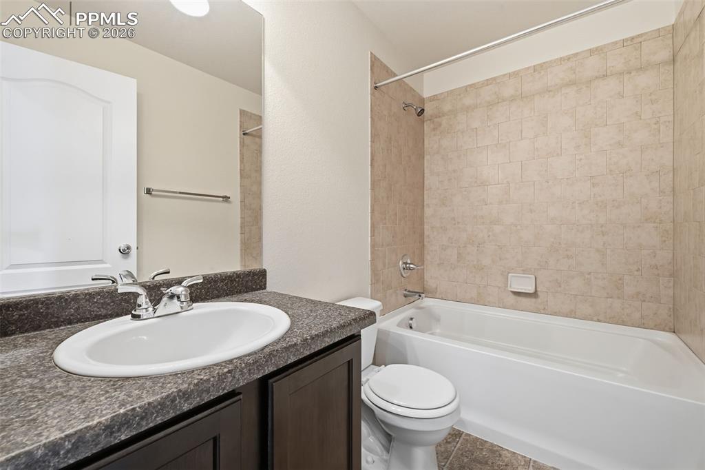Convenient full bath serving secondary bedrooms.