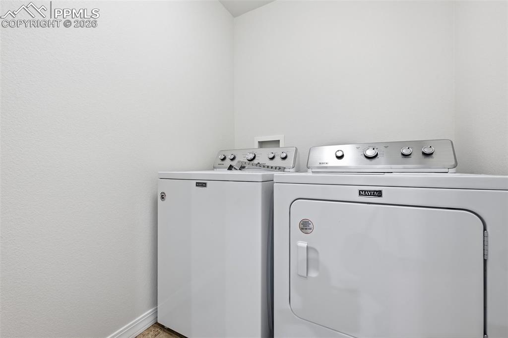 Upper-level laundry with included washer and dryer adds everyday practicality and ease.