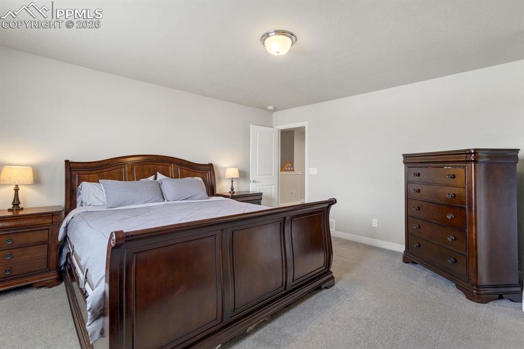 Bedroom with light carpet