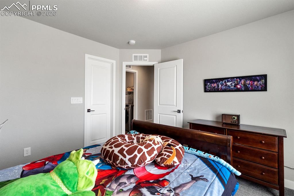 Bedroom featuring carpet floors