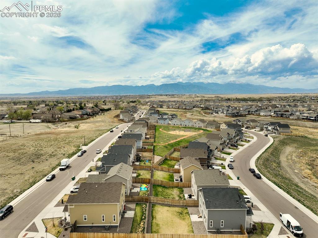 Aerial view of residential area featuring mountains