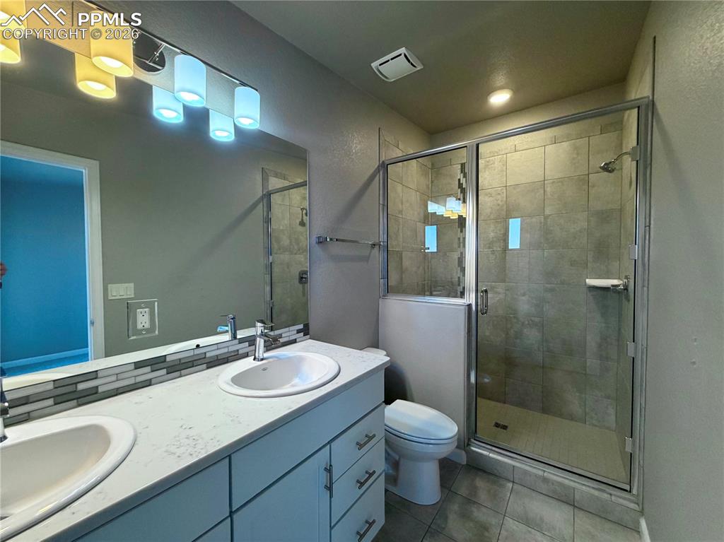 Dual Vanity, Quartz Countertops and Oversized Shower.