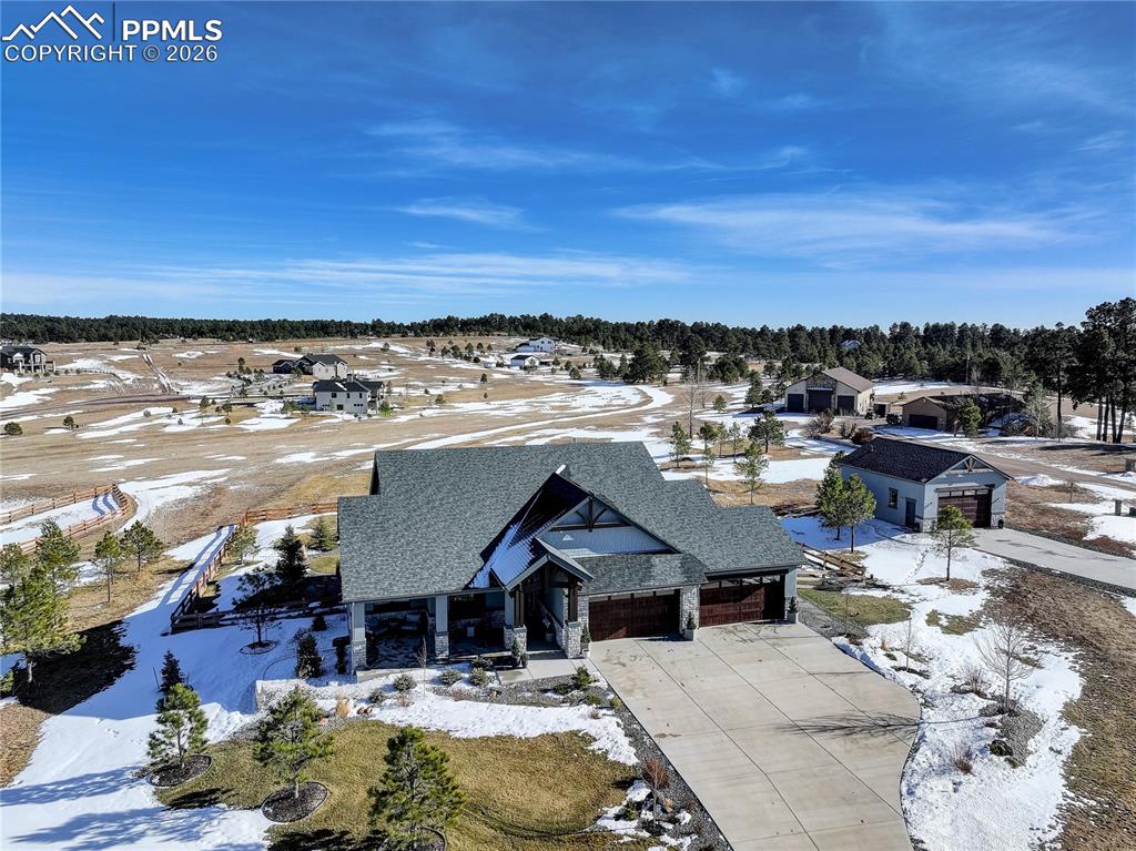 West facing front elevation showing detached 4-car garage / workshop