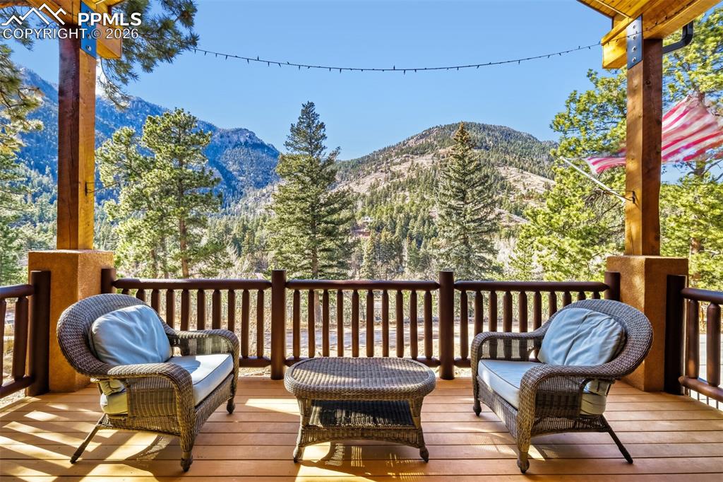 Front covered deck featuring a mountain view