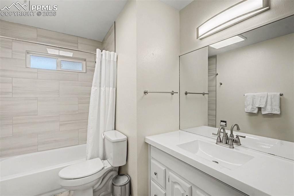 Bathroom featuring vanity and shower / bath combo
