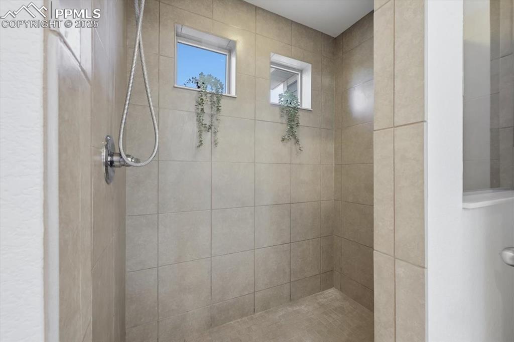 Bathroom with tiled shower