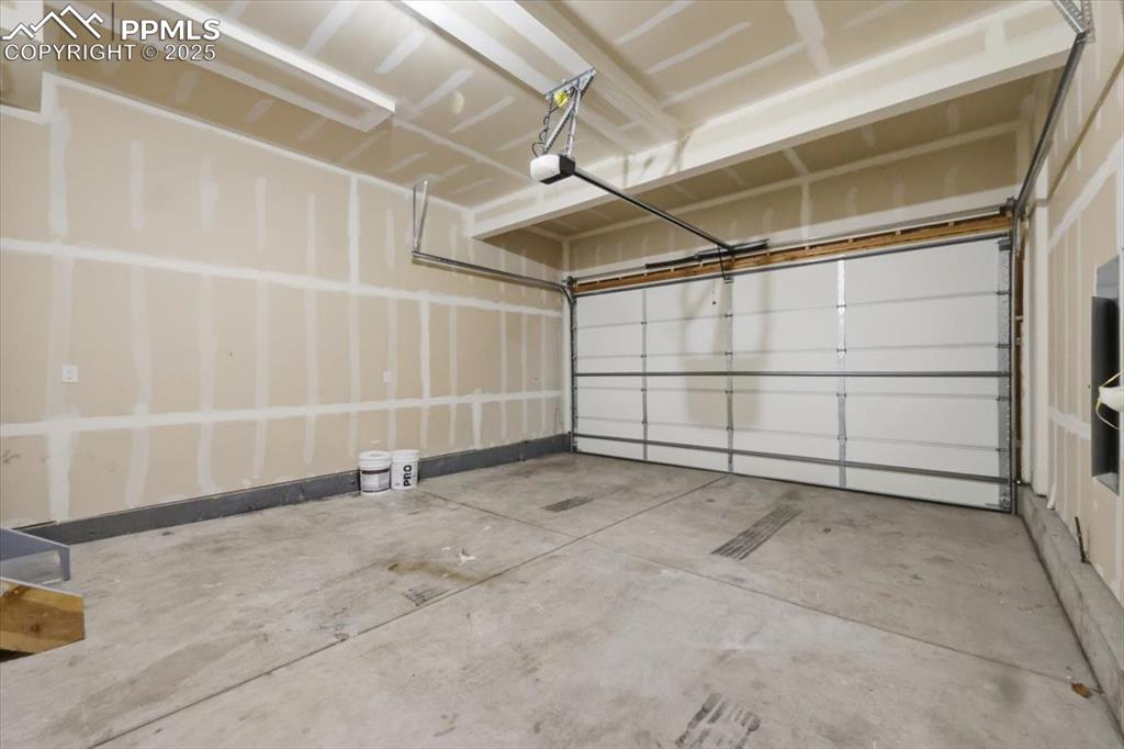 Garage featuring a garage door opener