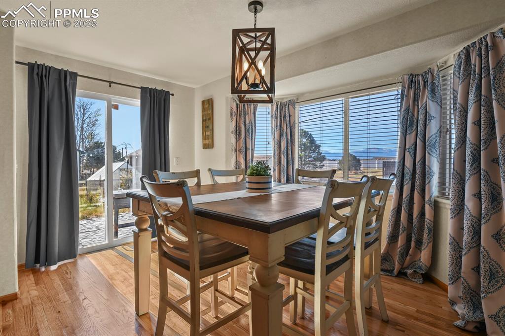 Dining room featuring light wood finished floors and baseboards