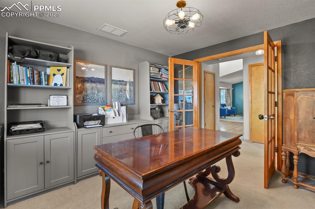 Office space featuring light carpet