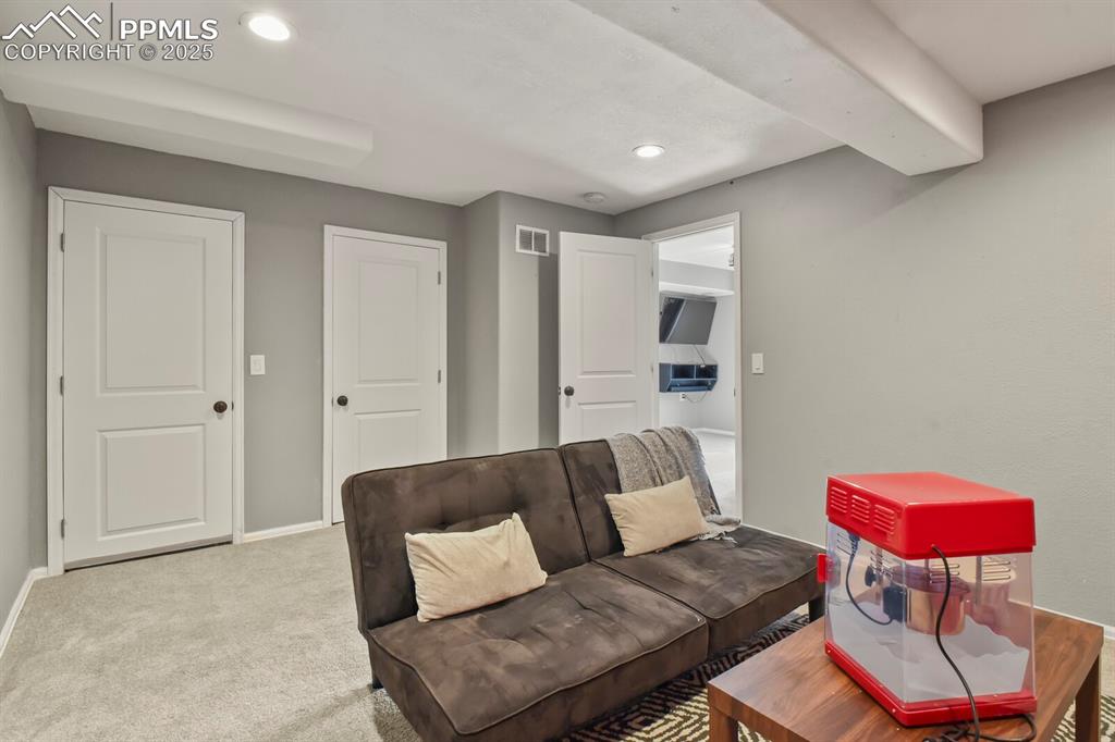 Living area featuring recessed lighting and carpet floors