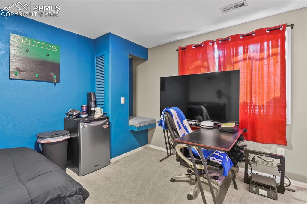 Office space featuring carpet flooring and baseboards