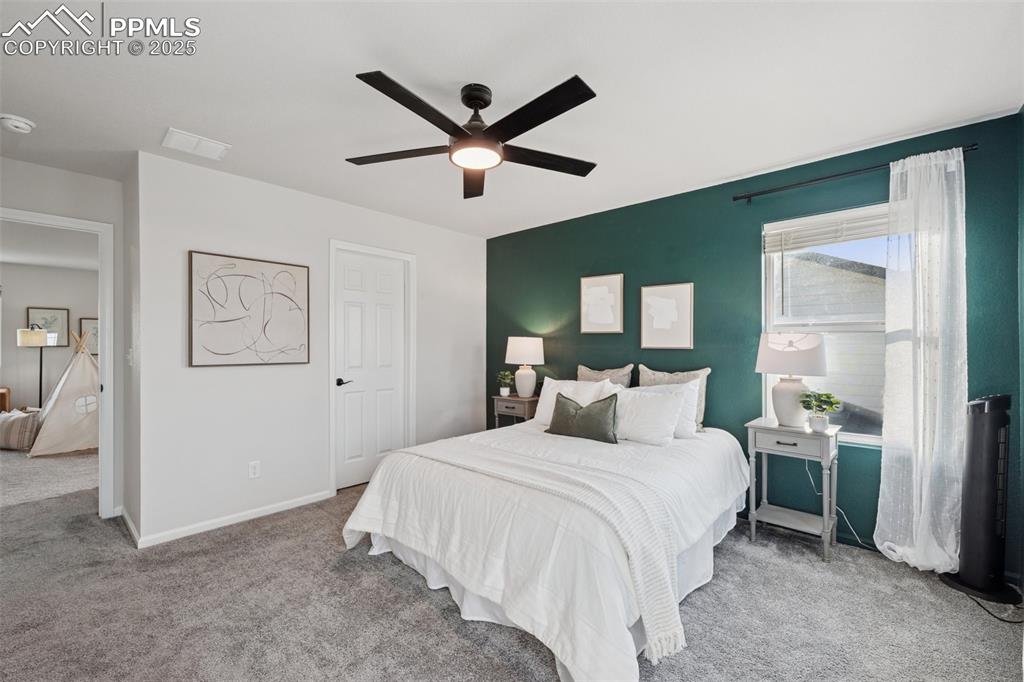 Bedroom with carpet flooring and ceiling fan