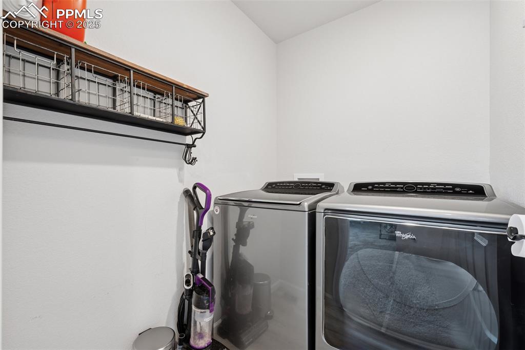 Laundry area featuring separate washer and dryer