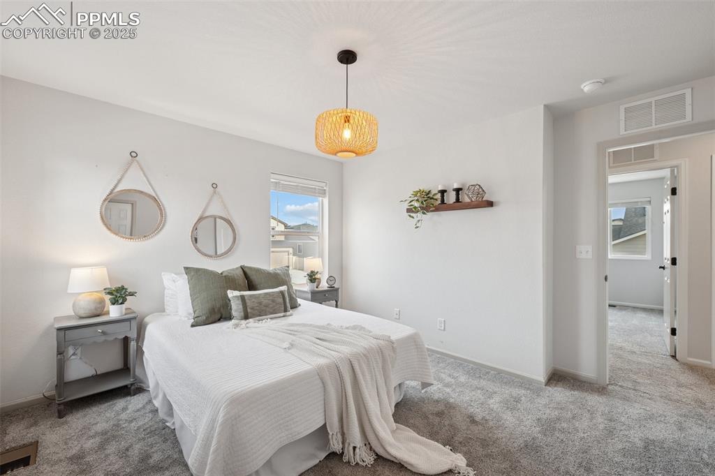 Carpeted bedroom with baseboards