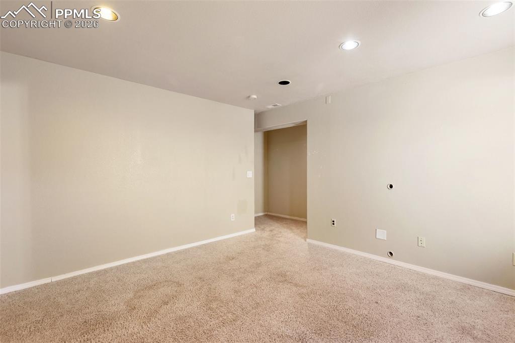 Unfurnished room featuring carpet floors and recessed lighting