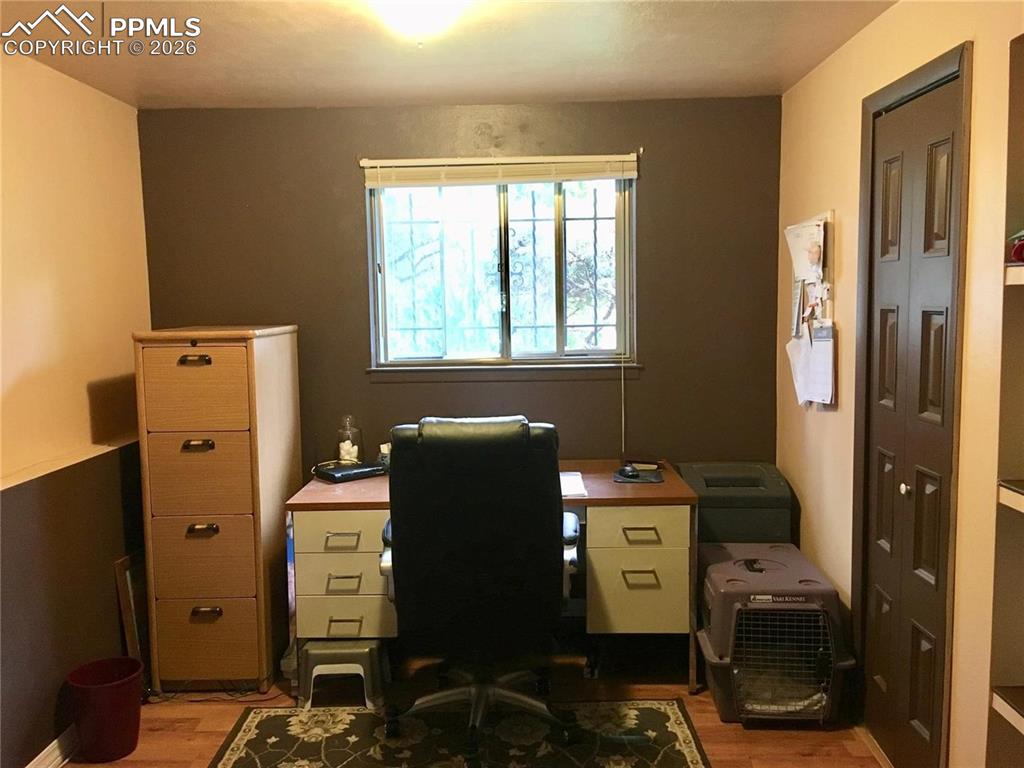 Lower level office area adjacent to family room. Add a wall and door for a 4th bedroom.
